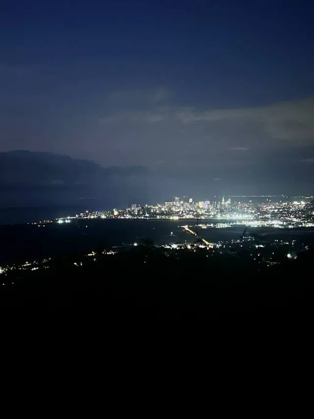 City lights beneath a dark blue sky