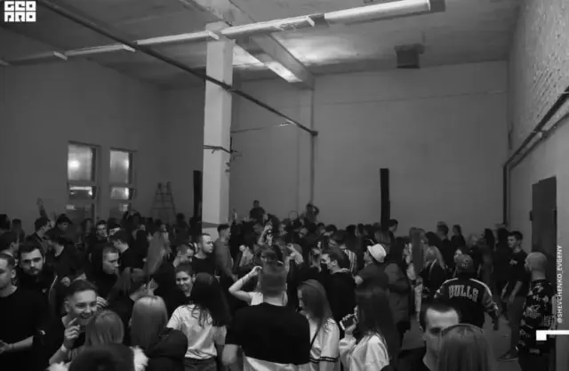 A crowd gathered in a performance space