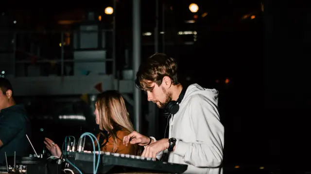 Alexey mixing music at a console